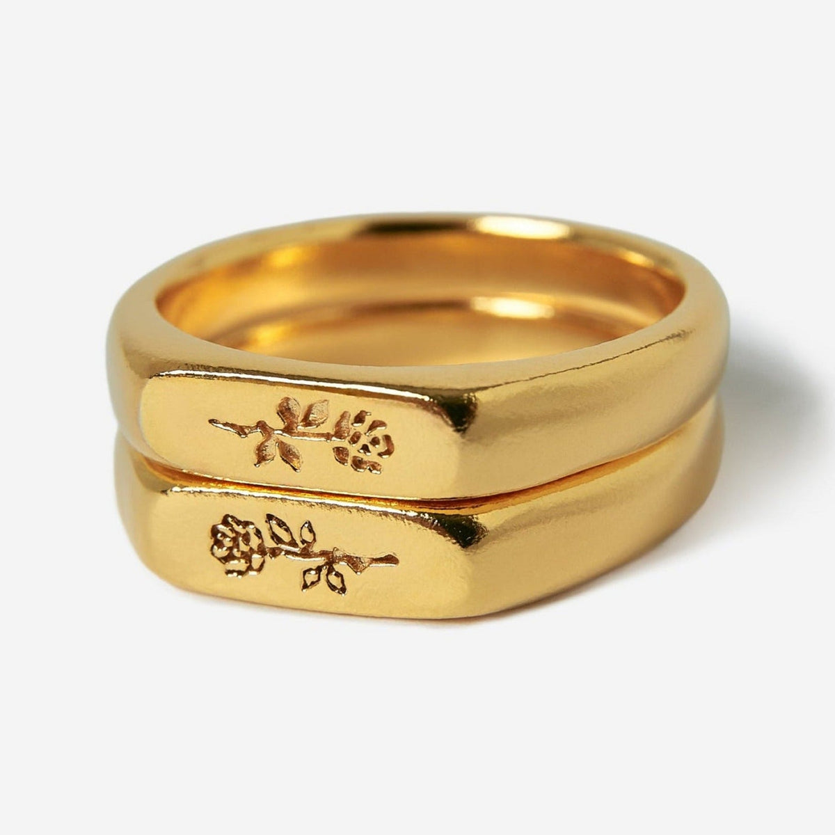 A pair of men's gold Rosa Stacker rings by Billie Jo, crafted from 18k gold vermeil and featuring a subtle, engraved rose design.