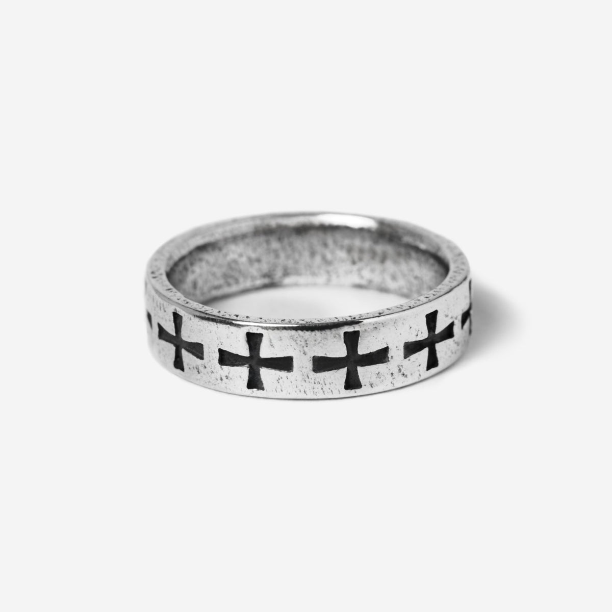 Billie Jo's Sanctum Ring in oxidised sterling silver, with a continuous band of carved cross motifs. Modern men's jewellery from Australia's Gold Coast.
