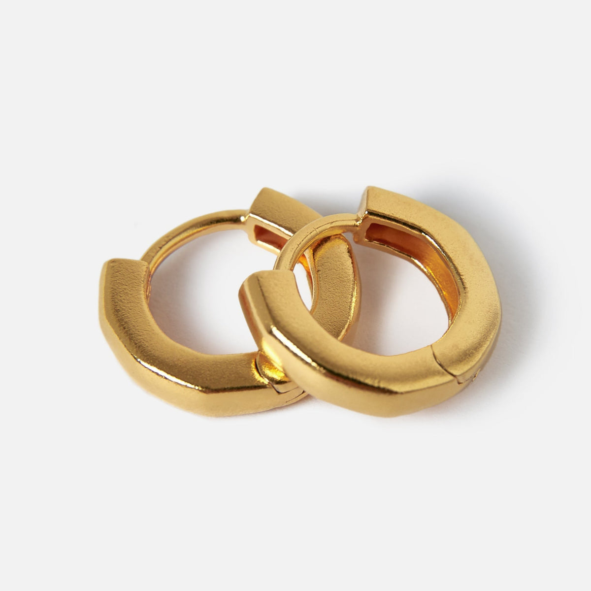 A pair of men's 18k gold vermeil Lumina Earrings from Billie Jo Jewellery, showcasing their modern, minimalist design against a clean, white background.
