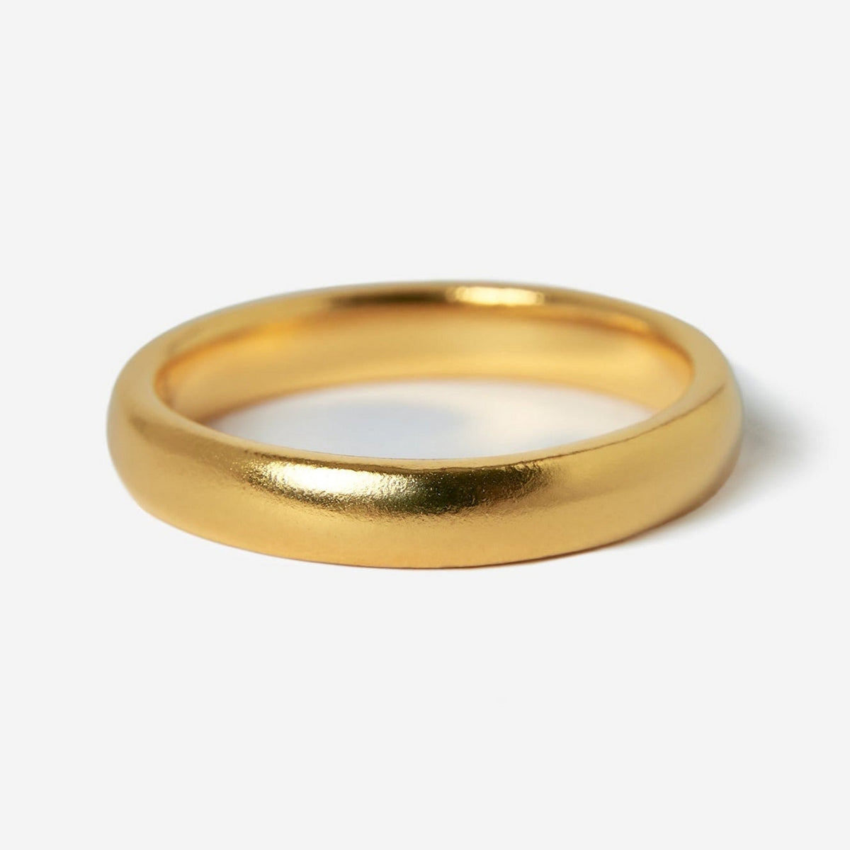 A single Billie Jo Stacker Ring in 18k gold vermeil, photographed on a white background to highlight its minimalist design and high-polish finish. A classic piece of men's jewellery.