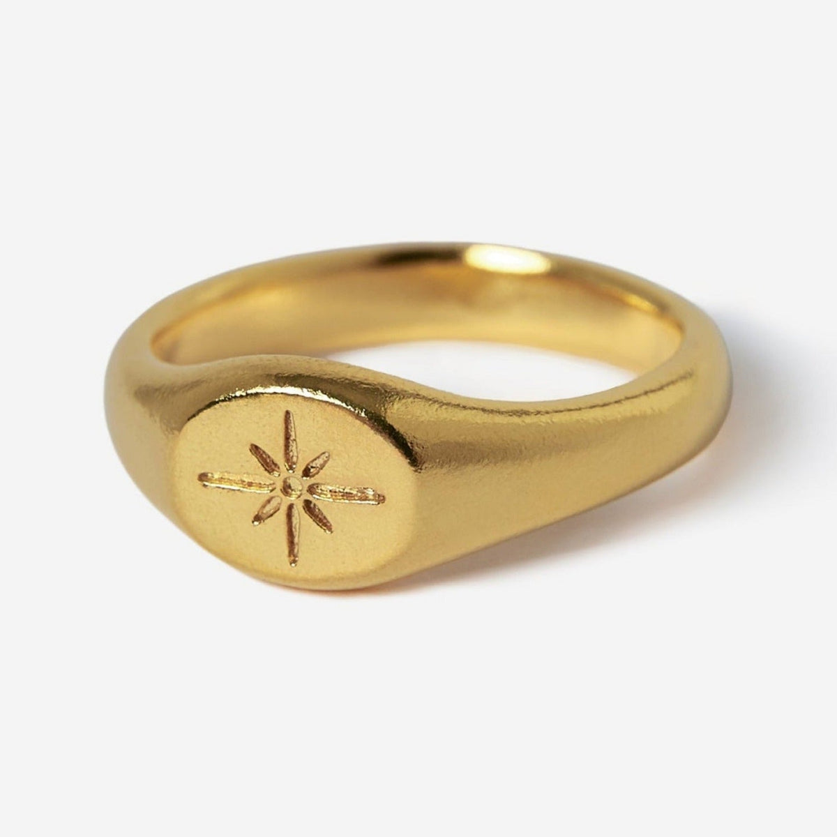 The Billie Jo Luminous Ring in 18k gold vermeil, a men's signet ring with a detailed starburst engraving, shown on a clean white background. Australian men's jewellery.