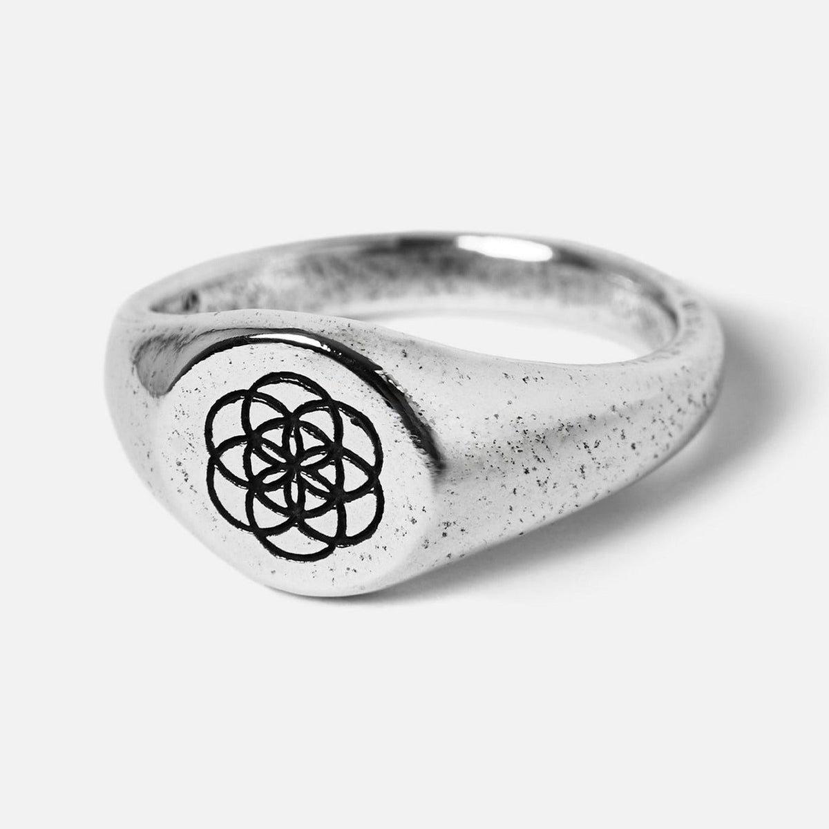 Billie Jo's UNITY RING in 925 sterling silver, a men's signet ring with a detailed geometric flower of life pattern and a unique textured finish.