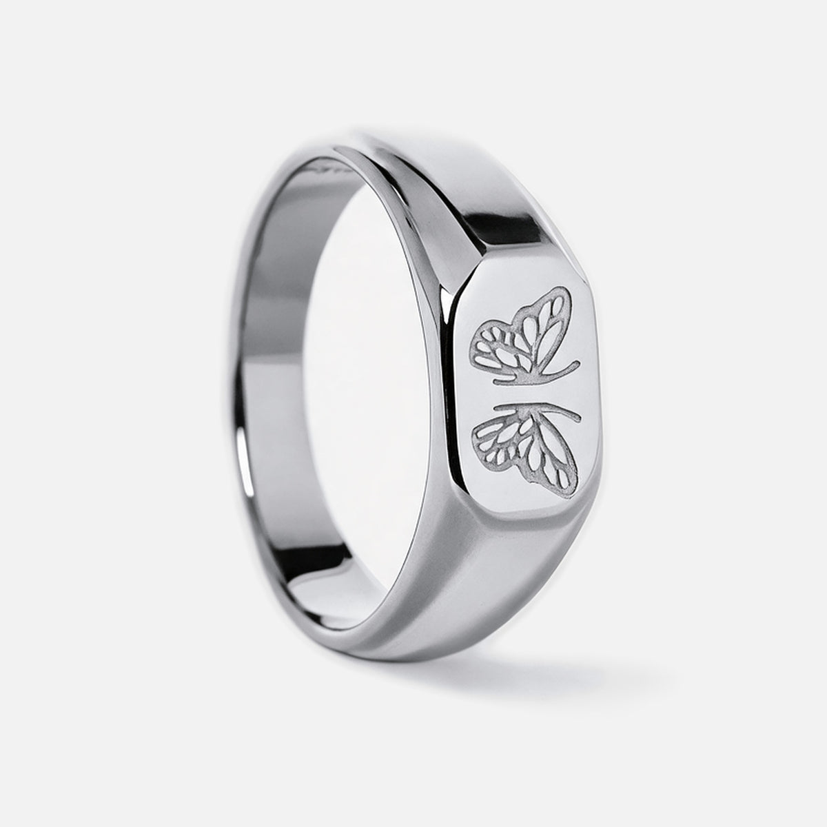 Men's Revival Ring in 316L stainless steel, silver finish, upright side view of the butterfly face, white background