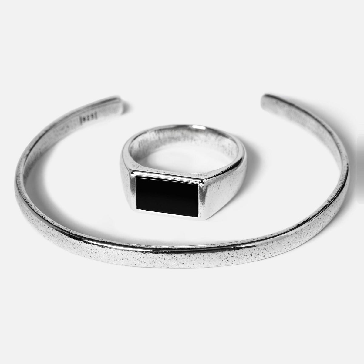 The Billie Jo Drifter & Onyx set for men. A sterling silver cuff bracelet and a matching ring with a rectangular black onyx stone.