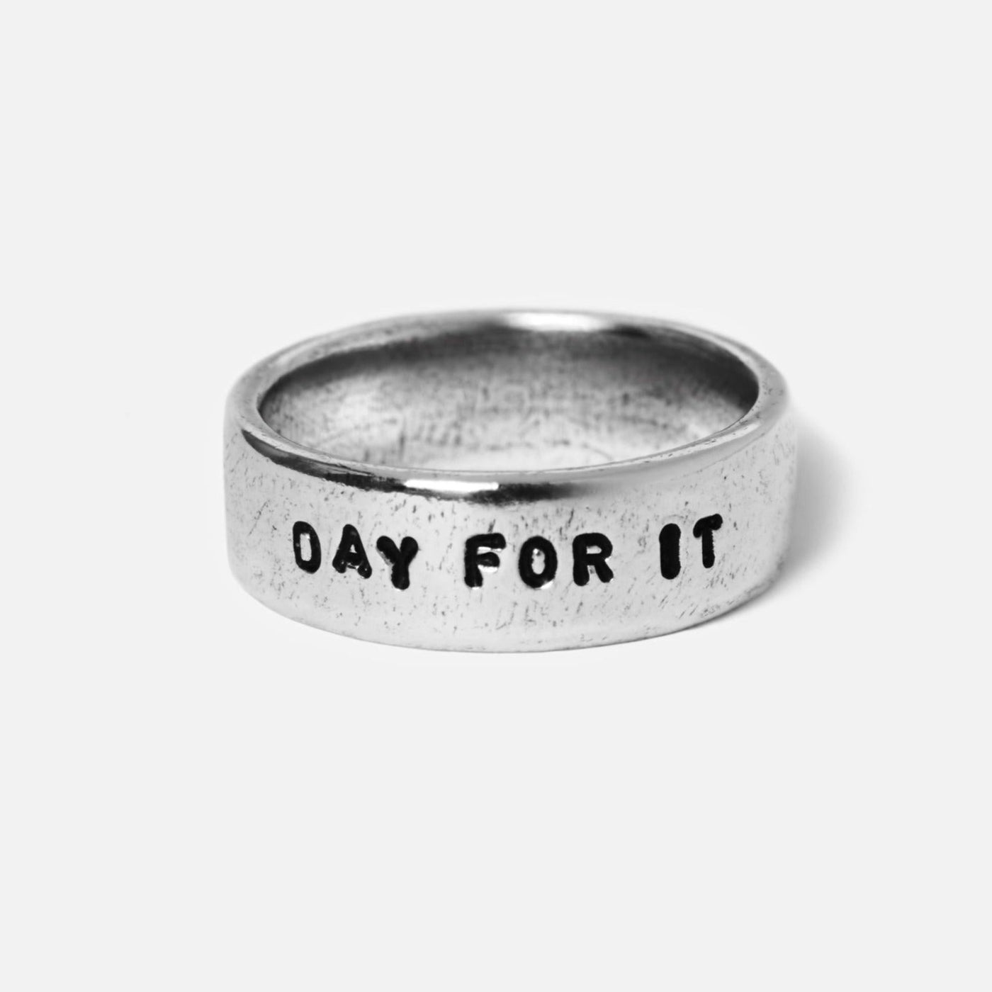 Detail shot of the sterling silver Custom Stamped Ring by Australian men's jewellery brand Billie Jo, with the phrase '''DAY FOR IT''' stamped on it.