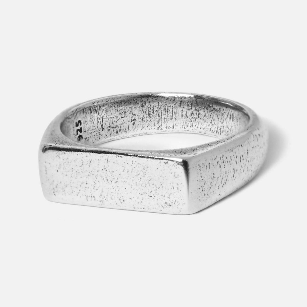 A sterling silver signet ring from Australian men's jewellery brand Billie Jo. The Elation Ring has a textured, brushed finish on its rectangular face.