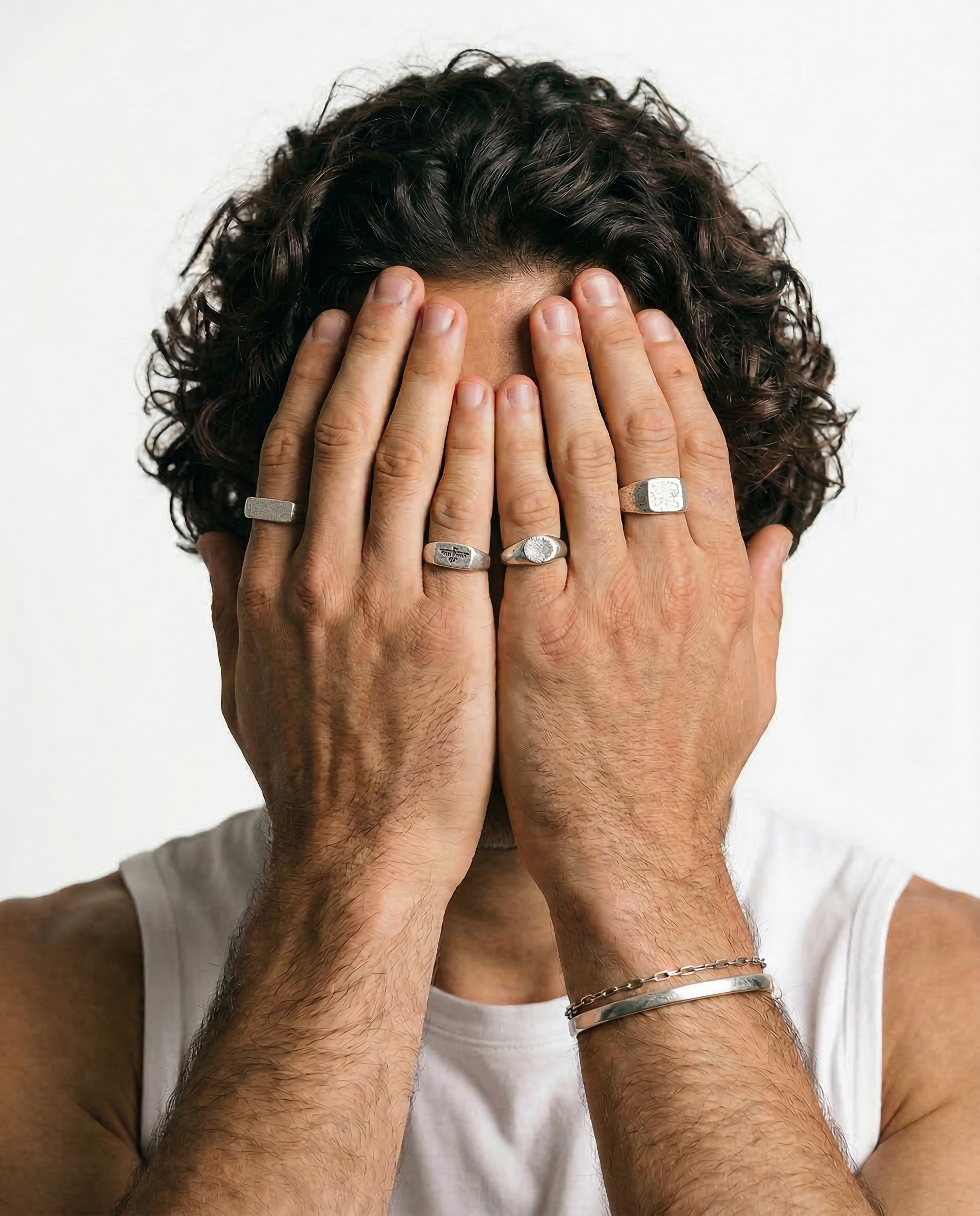 Mens rings stacked on male hand, Billie Jo sterling silver rings styled for everyday wear on the Gold Coast