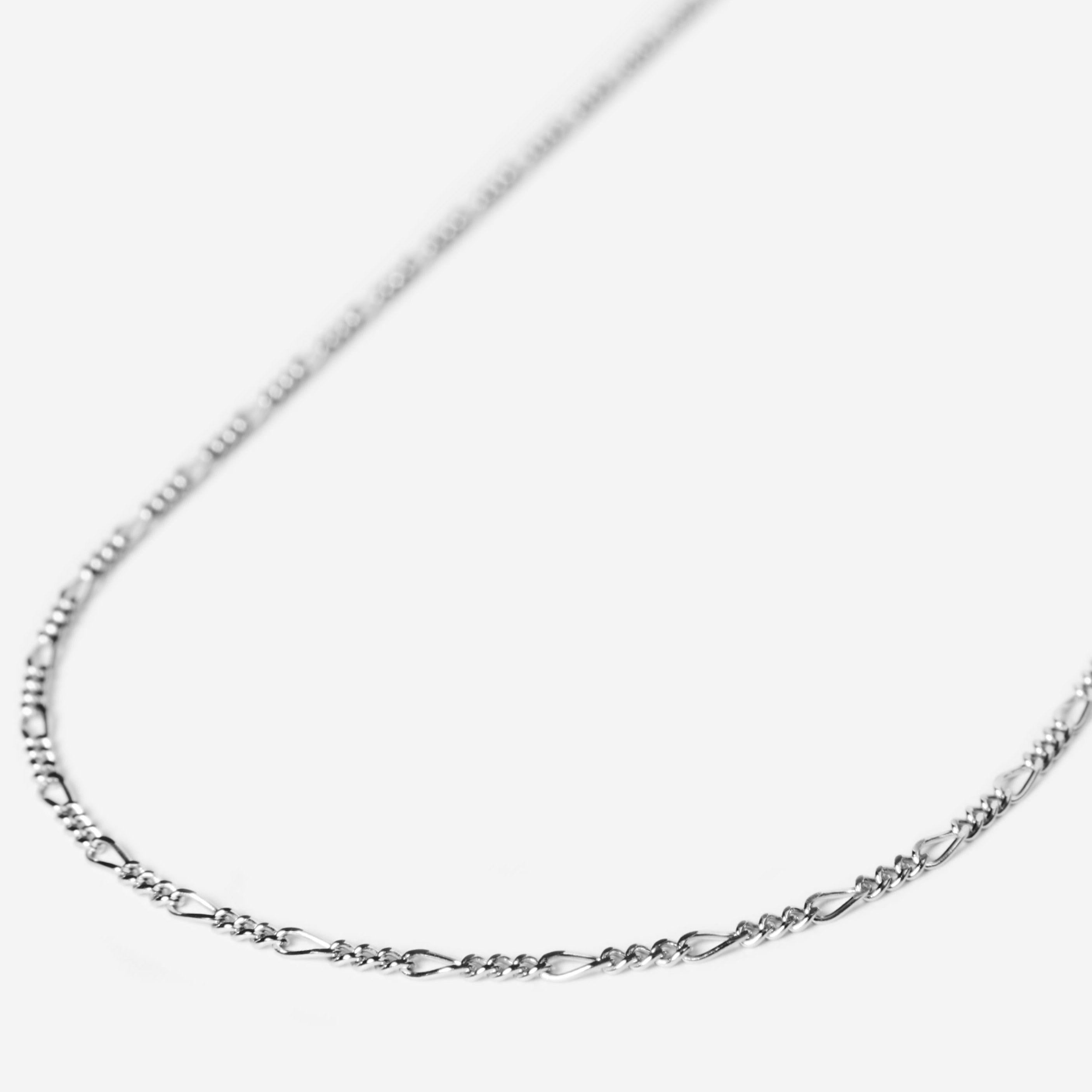 A sterling silver Slim Figaro Necklace from Australian men's jewellery brand Billie Jo, showcasing its classic, delicate figaro chain design on a clean white background.
