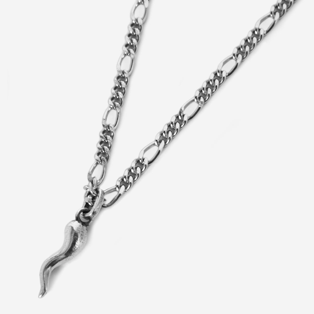 A sterling silver Chilli Pendant necklace from Billie Jo, featuring a detailed, curved horn charm on a classic figaro chain against a clean, white background.