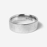 The Billie Jo Canvas Ring in sterling silver, a classic band with a subtly textured finish. A versatile piece of Australian men's jewellery.