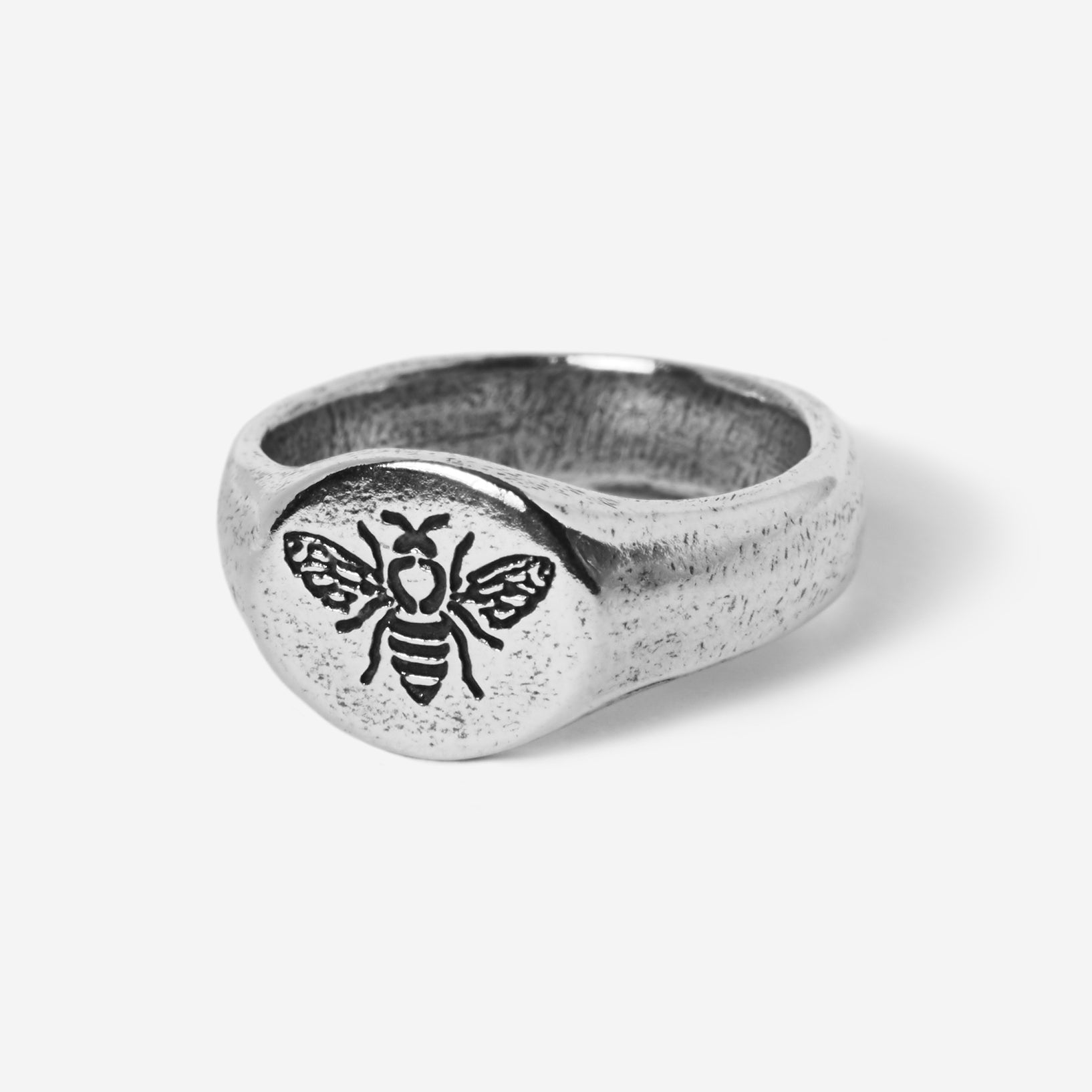 A detailed product shot of the Billie Jo BEE THERE RING in 925 sterling silver, featuring a rustic finish and an intricately engraved bee on its oval face.
