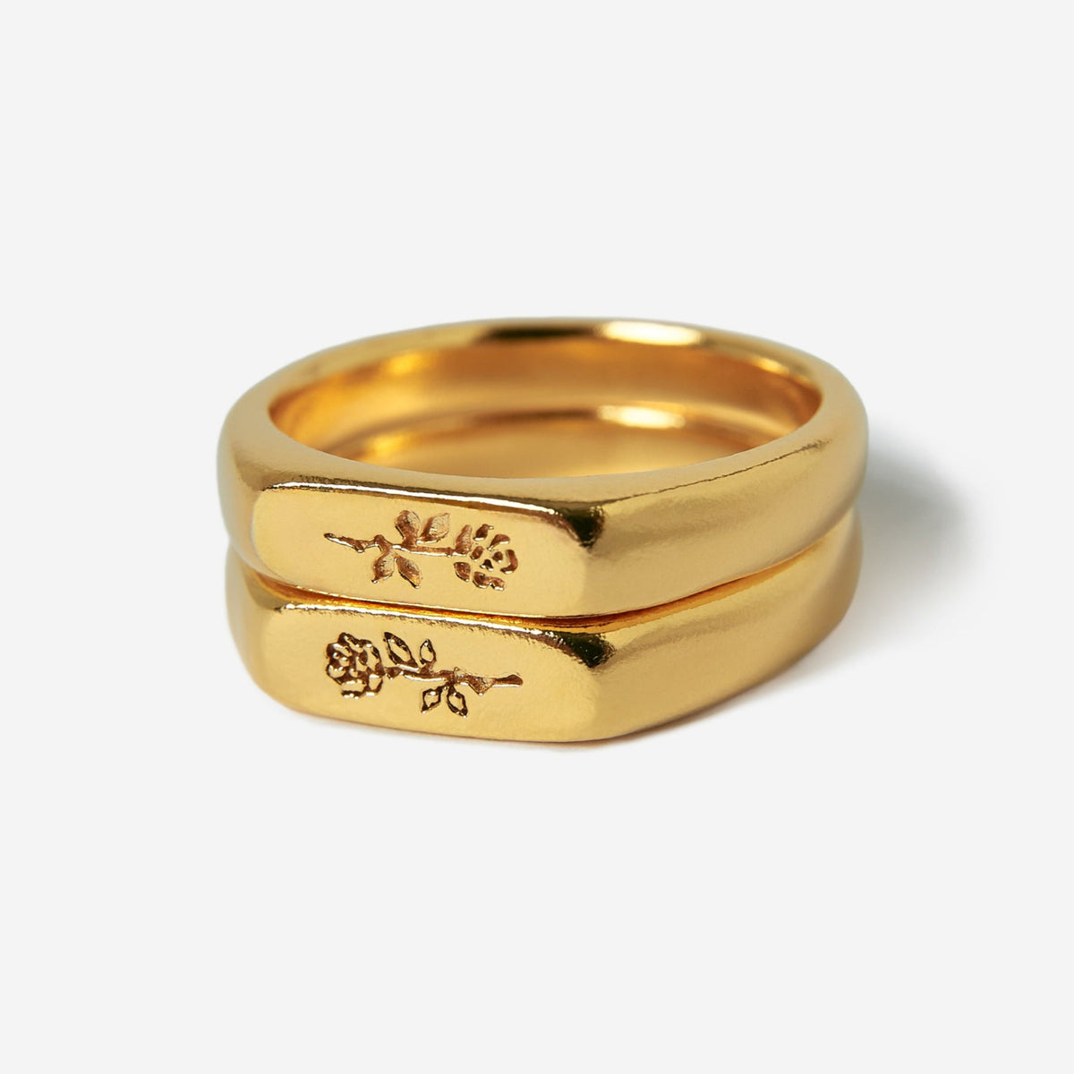 A pair of men's gold Rosa Stacker rings by Billie Jo, crafted from 18k gold vermeil and featuring a subtle, engraved rose design.