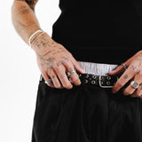 A close-up of the Billie Jo Slim Rope Bracelet on a tattooed wrist, showing the intricate rope detailing and sterling silver finish.