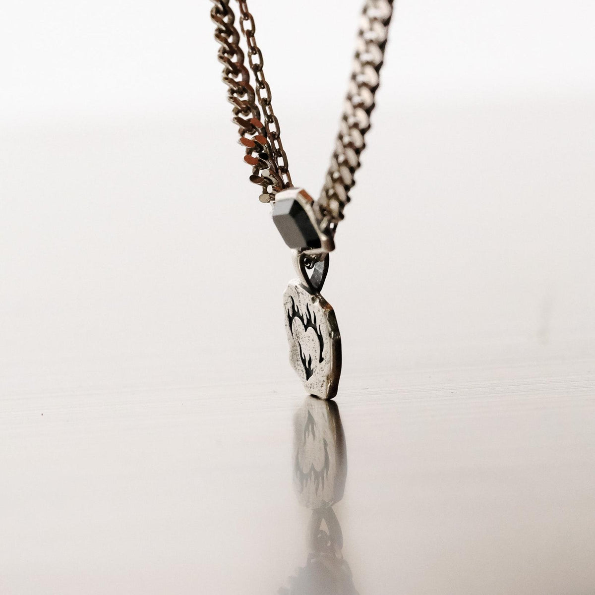 Side profile of the sterling silver Ember Pendant, showing its thickness and the quality of the craftsmanship by Australian brand Billie Jo.