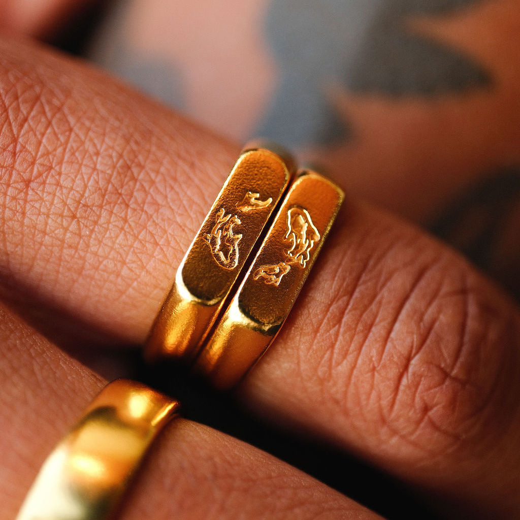 A detailed close-up of the Billie Jo Koi I Ring in 18k gold vermeil, showing the intricate koi fish engraving. This men's ring is a statement piece of Australian jewellery.