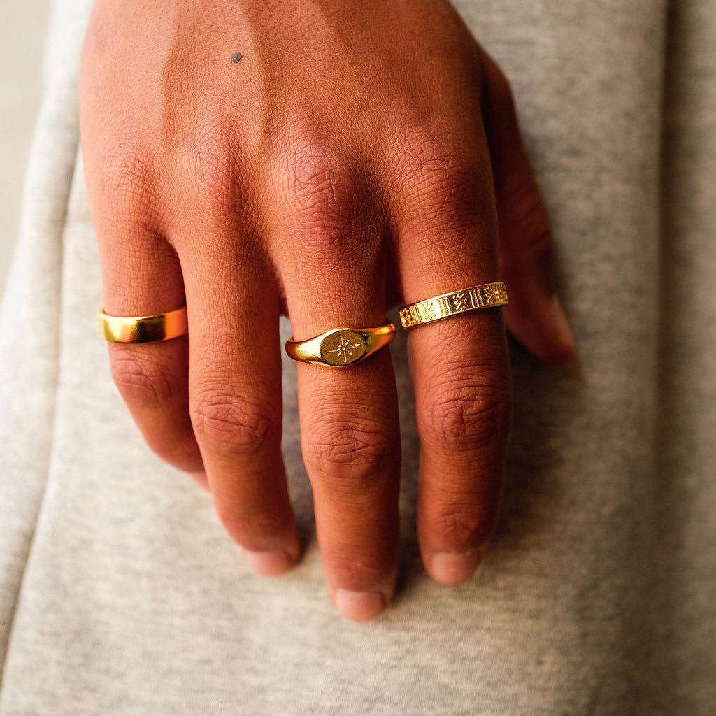 On-hand shot of the men's Gold Relic Ring by Billie Jo, showing its textured design and 18k gold vermeil finish. A versatile piece of Australian men's jewellery.