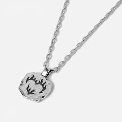 Billie Jo Ember Pendant in 925 sterling silver. The textured, square-shaped pendant features a flaming heart design and hangs from a classic chain.