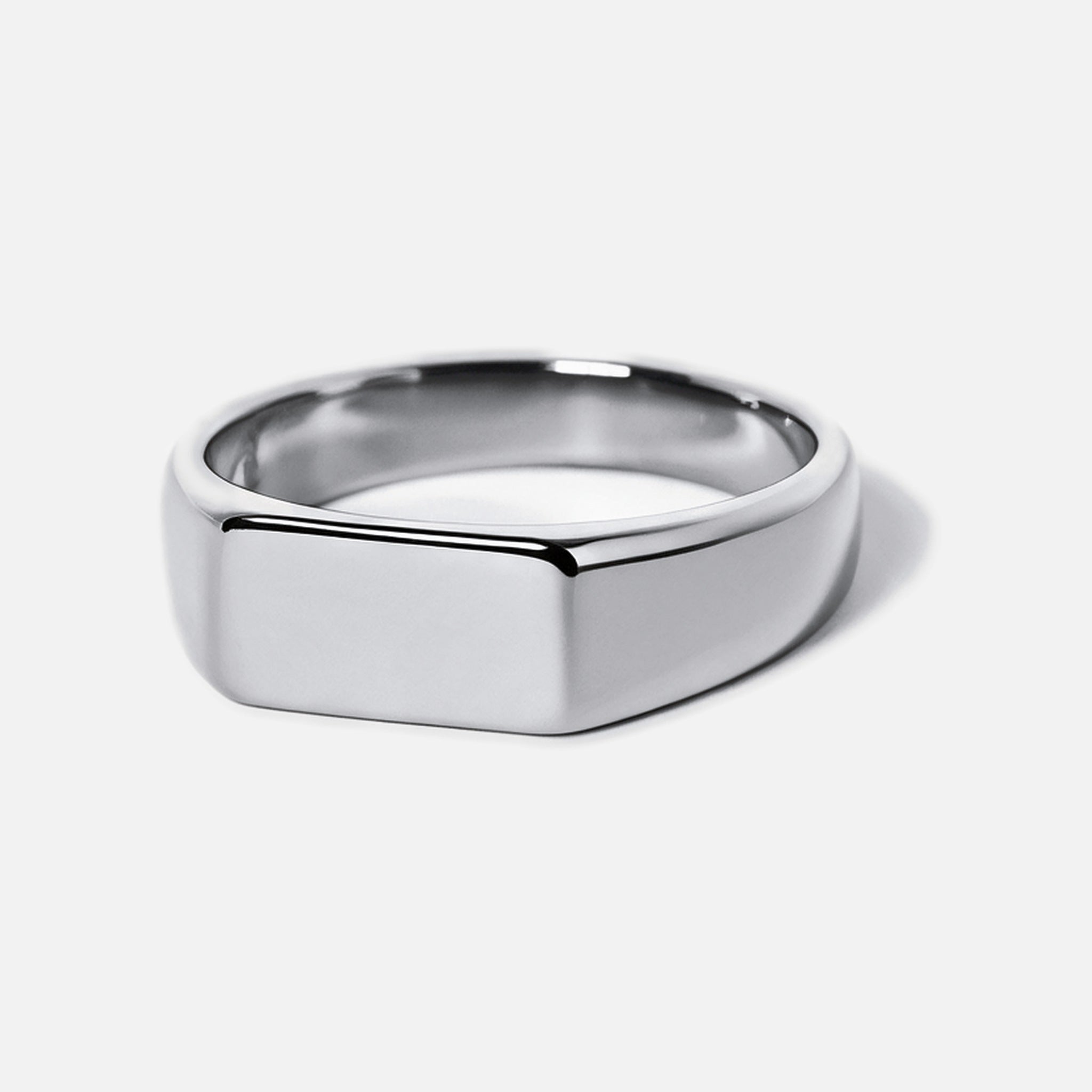 Men's Genesis Ring in 316L stainless steel, silver finish, angled view of the blank flat face, white background