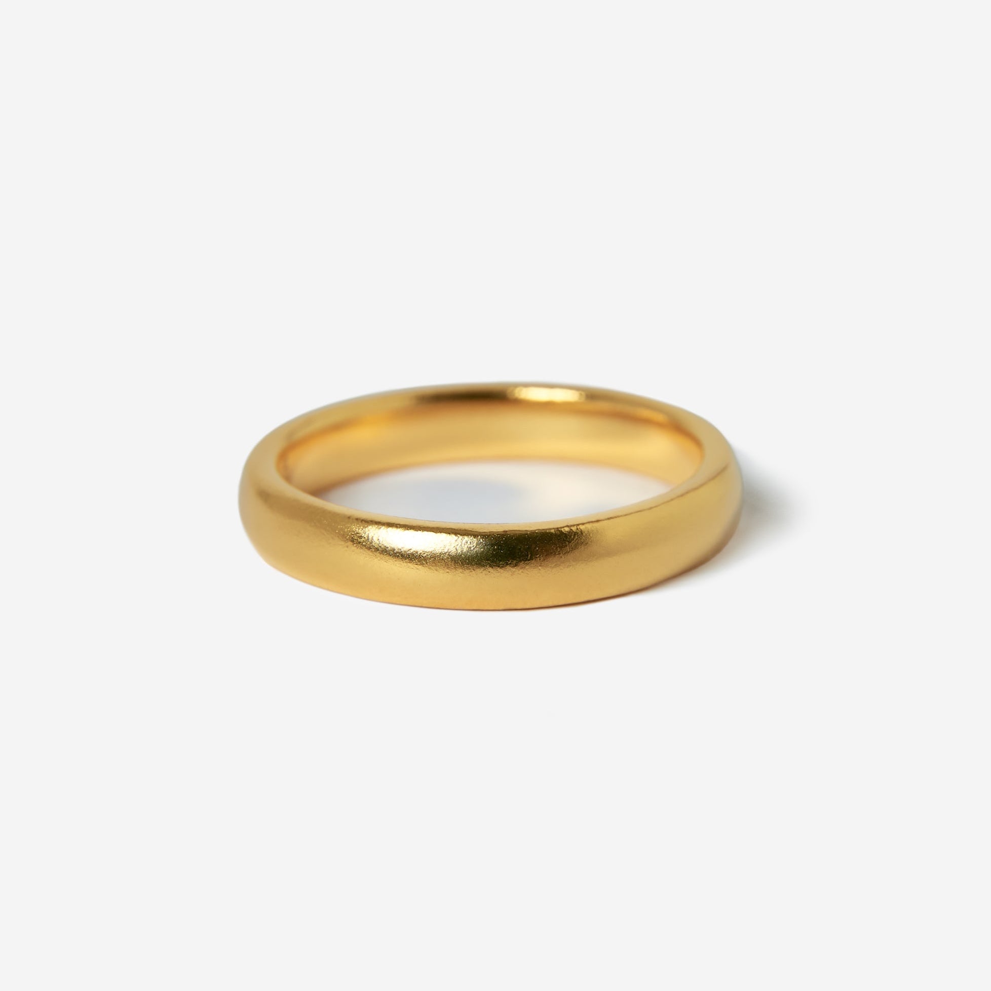 A single Billie Jo Stacker Ring in 18k gold vermeil, photographed on a white background to highlight its minimalist design and high-polish finish. A classic piece of men's jewellery.