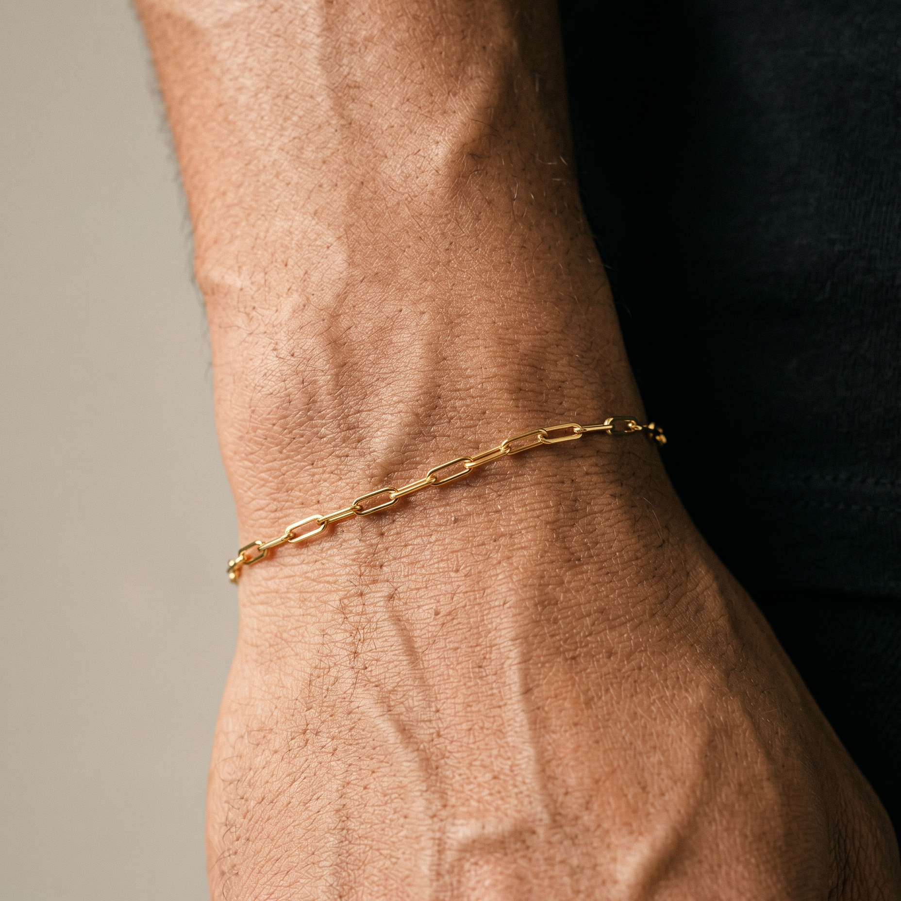 Stainless Steel Gold Bracelet on male black tee shirt