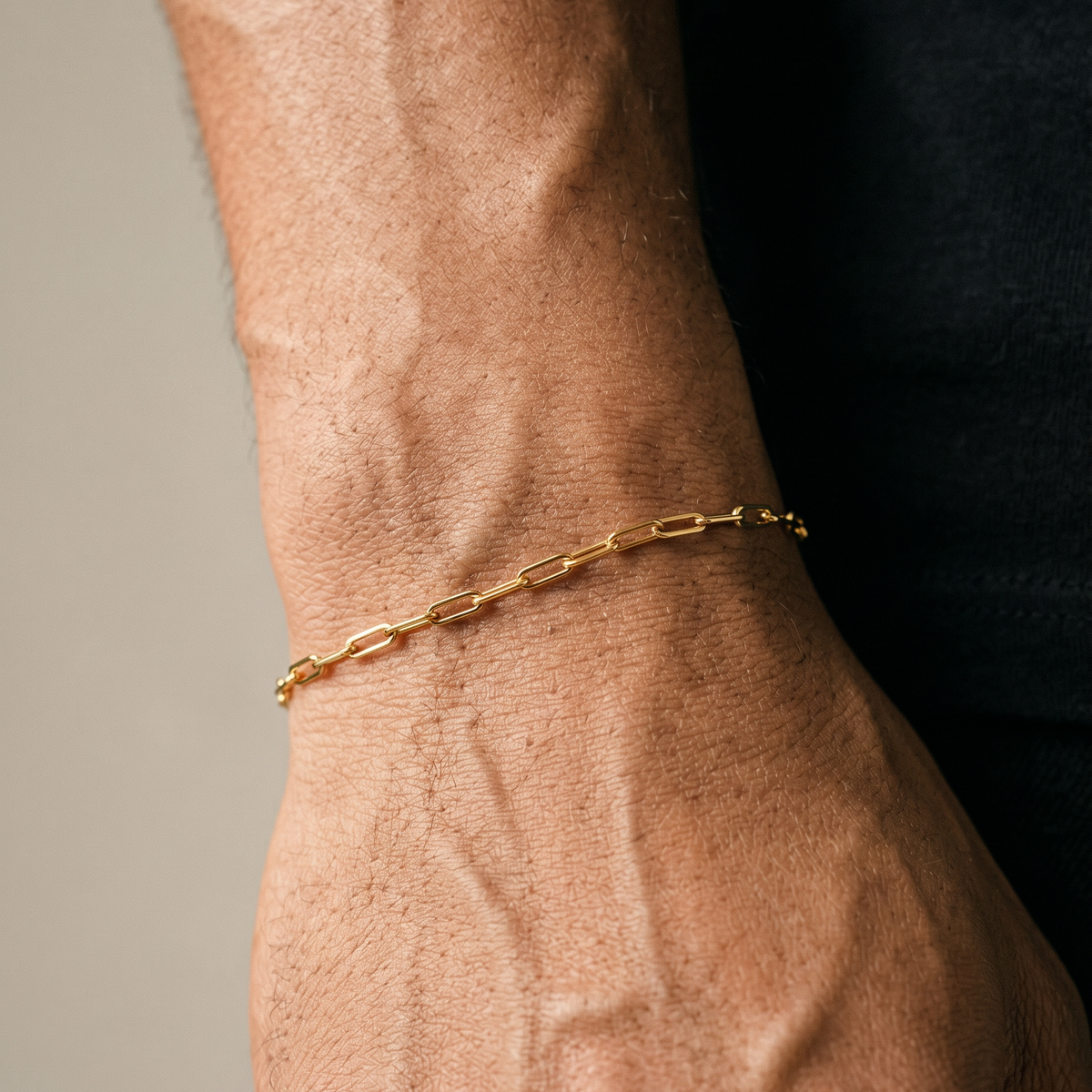 Stainless Steel Gold Bracelet on male black tee shirt