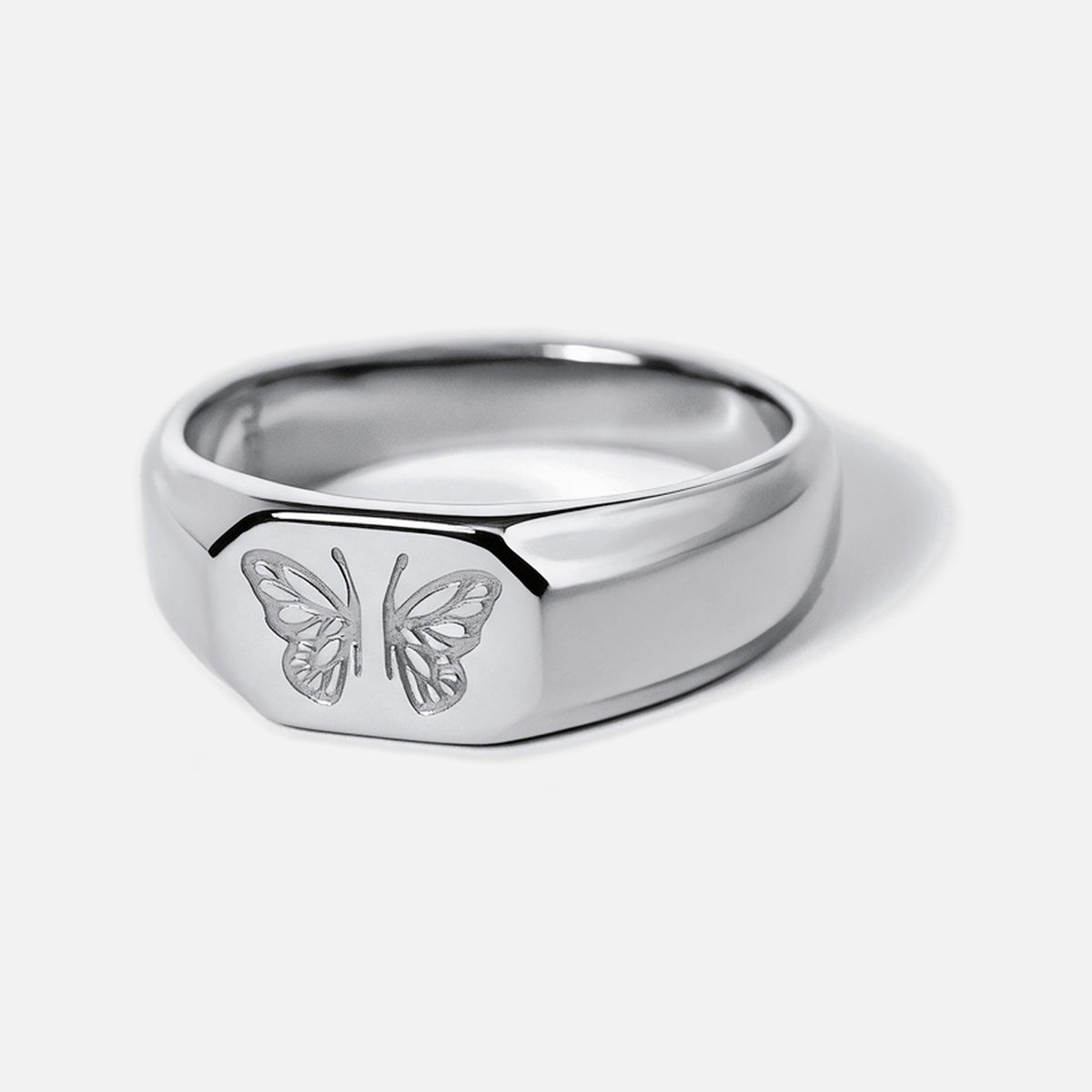 Men's Revival Ring in 316L stainless steel, silver finish, front angle showing the engraved butterfly, white background