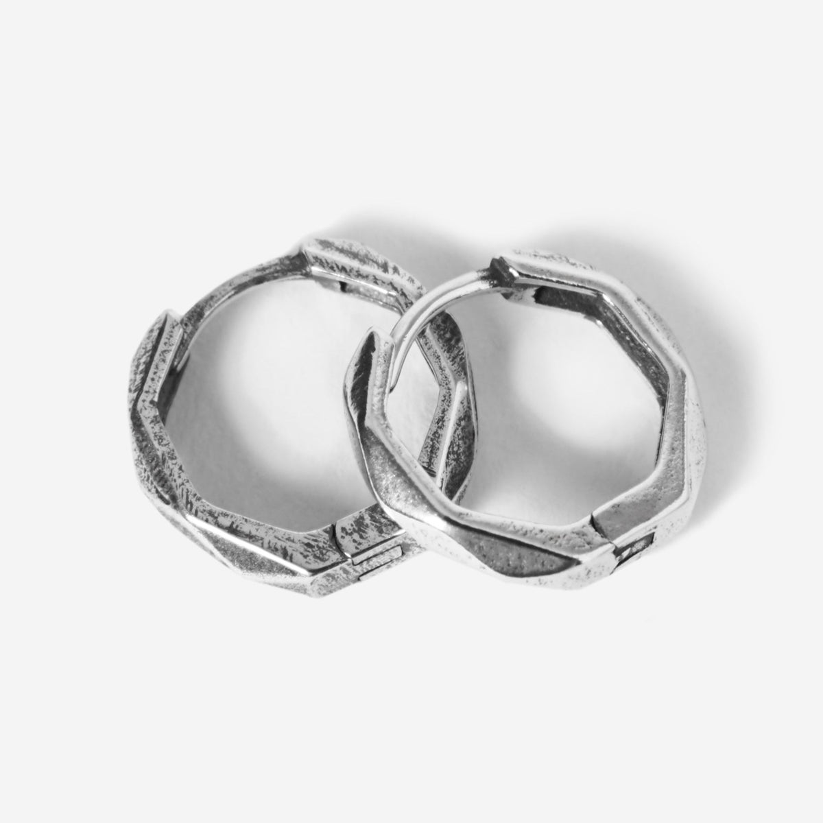 A pair of sterling silver Carve Earrings from Billie Jo, featuring a unique, hand-carved geometric design for a modern, masculine look. Australian men's jewellery.
