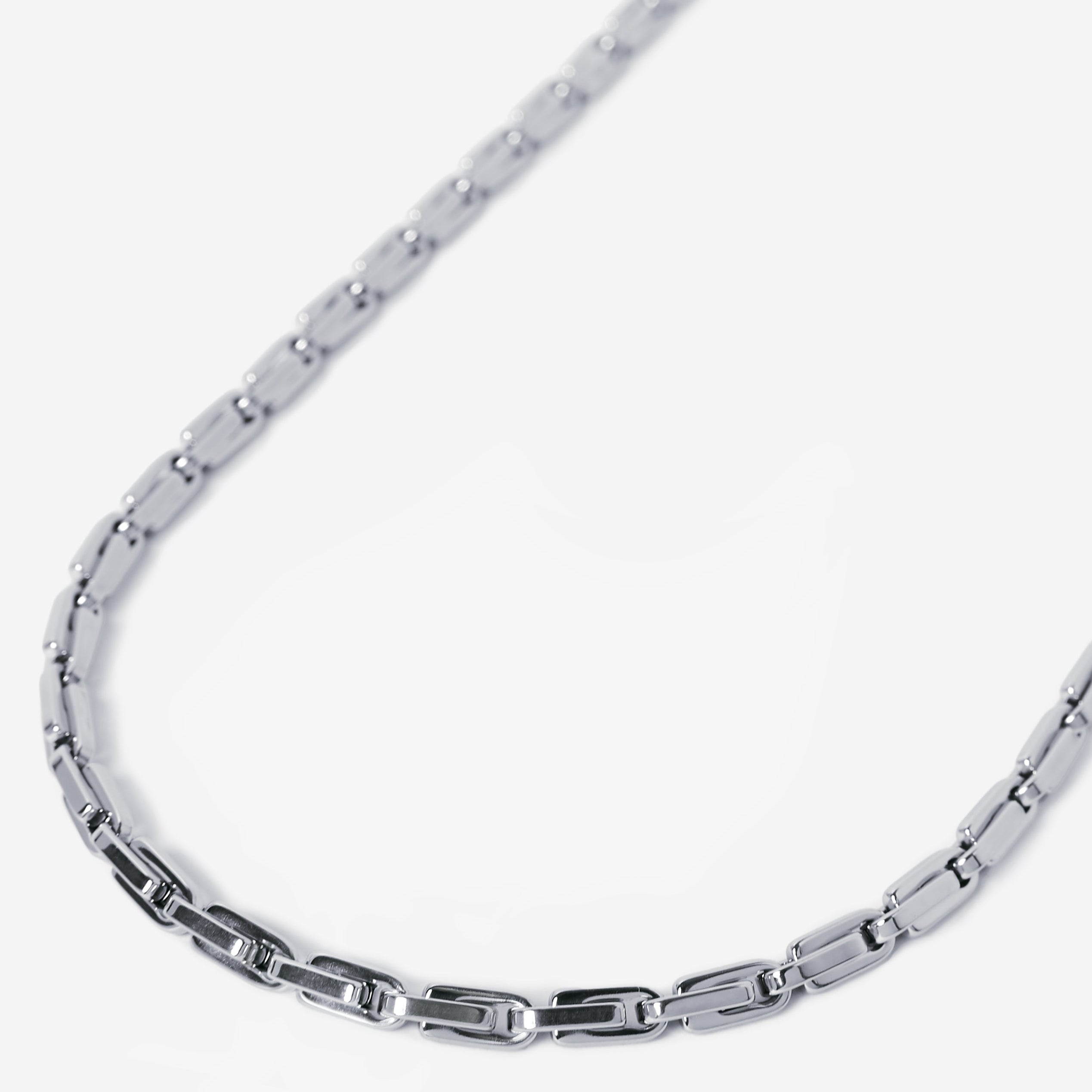 Silver chain necklace on a white background