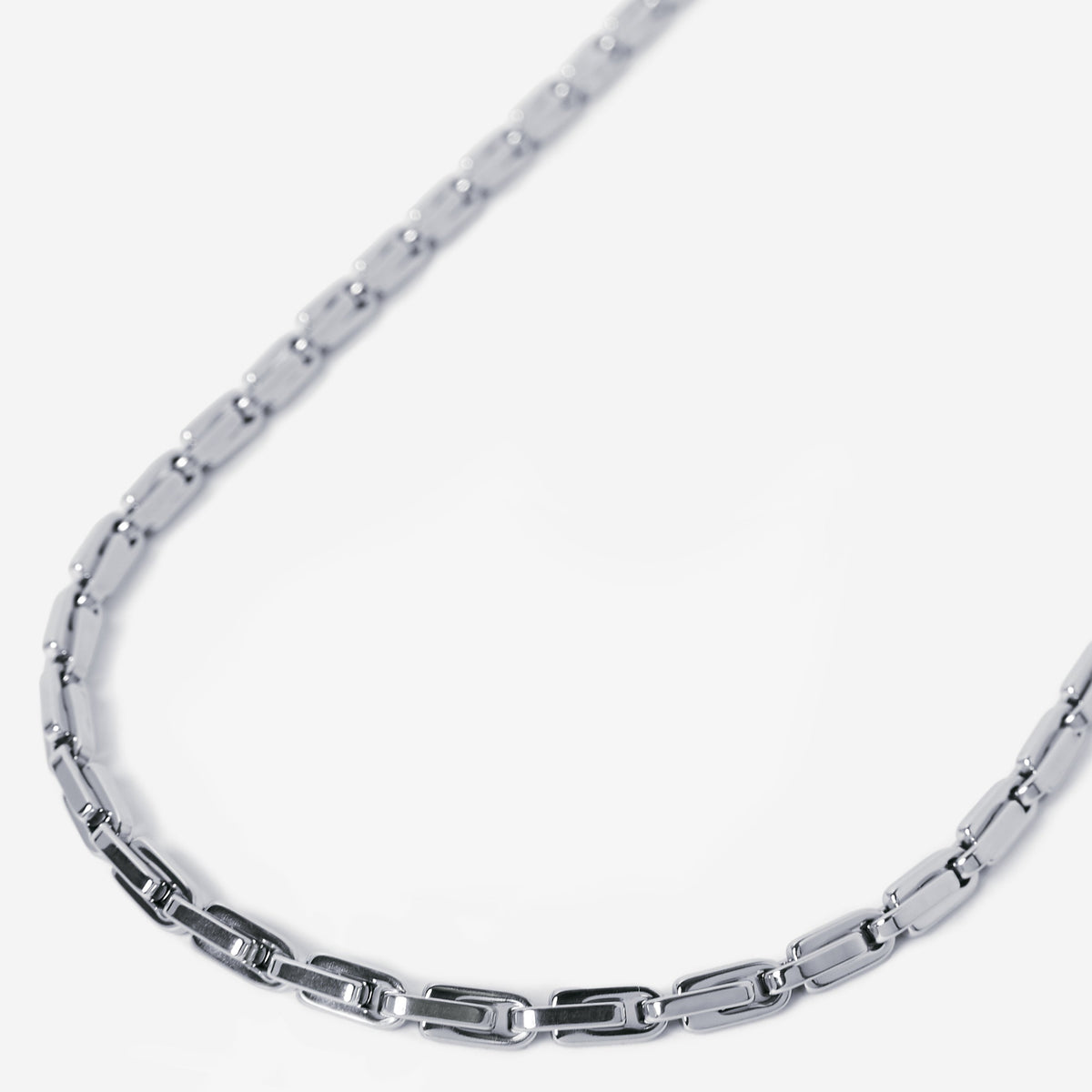 Silver chain necklace on a white background