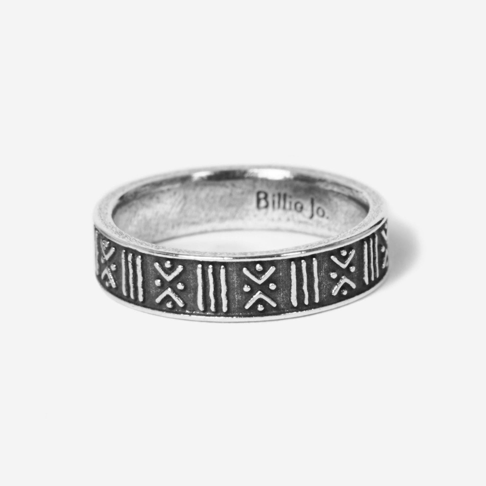 A product shot of the sterling silver Relic Ring from Billie Jo, showing the engraved brand name on the inside of the band.