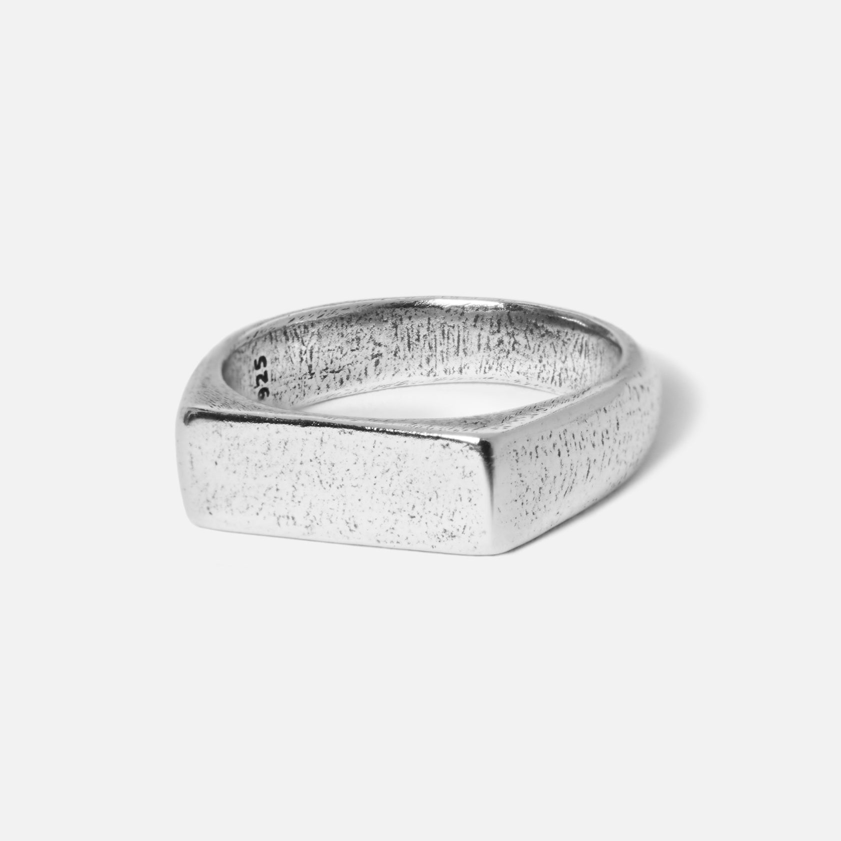 A sterling silver signet ring from Australian men's jewellery brand Billie Jo. The Elation Ring has a textured, brushed finish on its rectangular face.