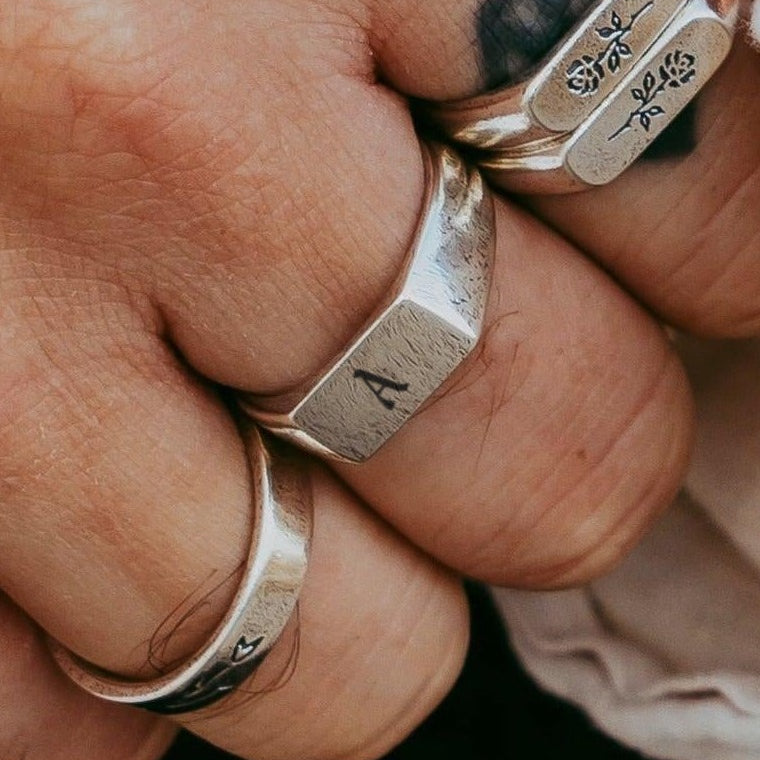 Initial Genesis Ring with the letter A, worn on a man's hand