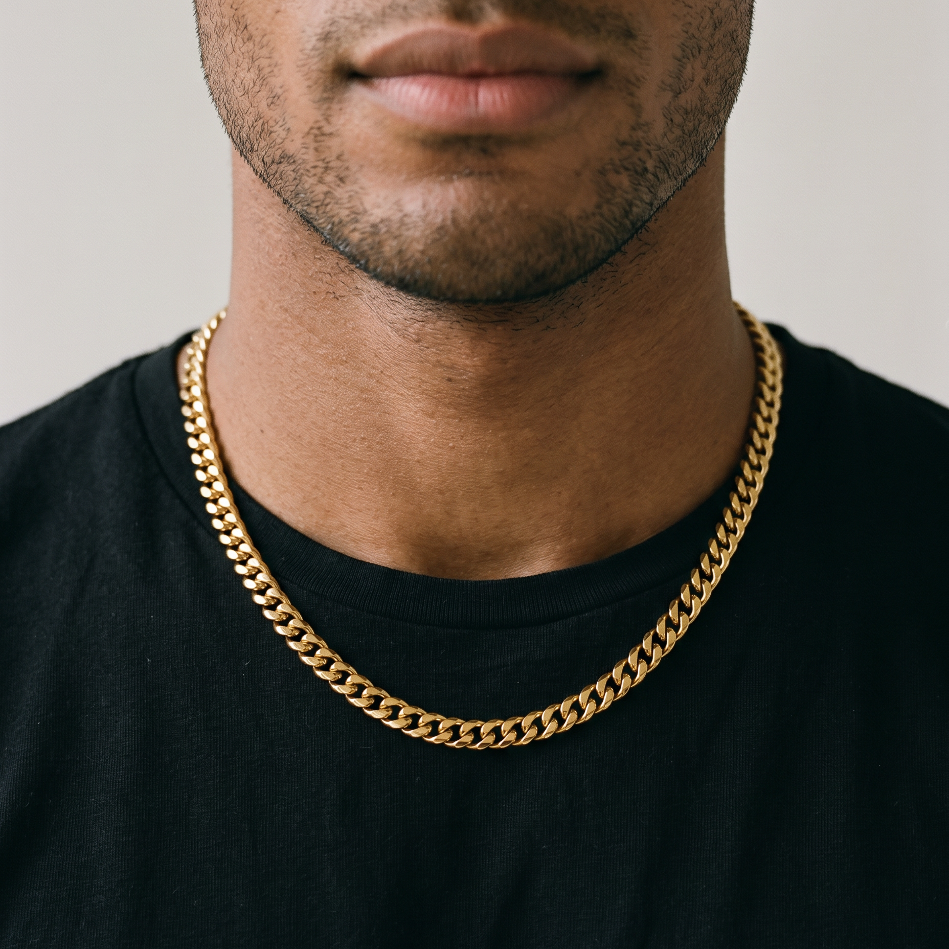 A man wearing a gold stainless steel necklace, from Australian jewellery brand Billie Jo, styled for everyday casual wear.