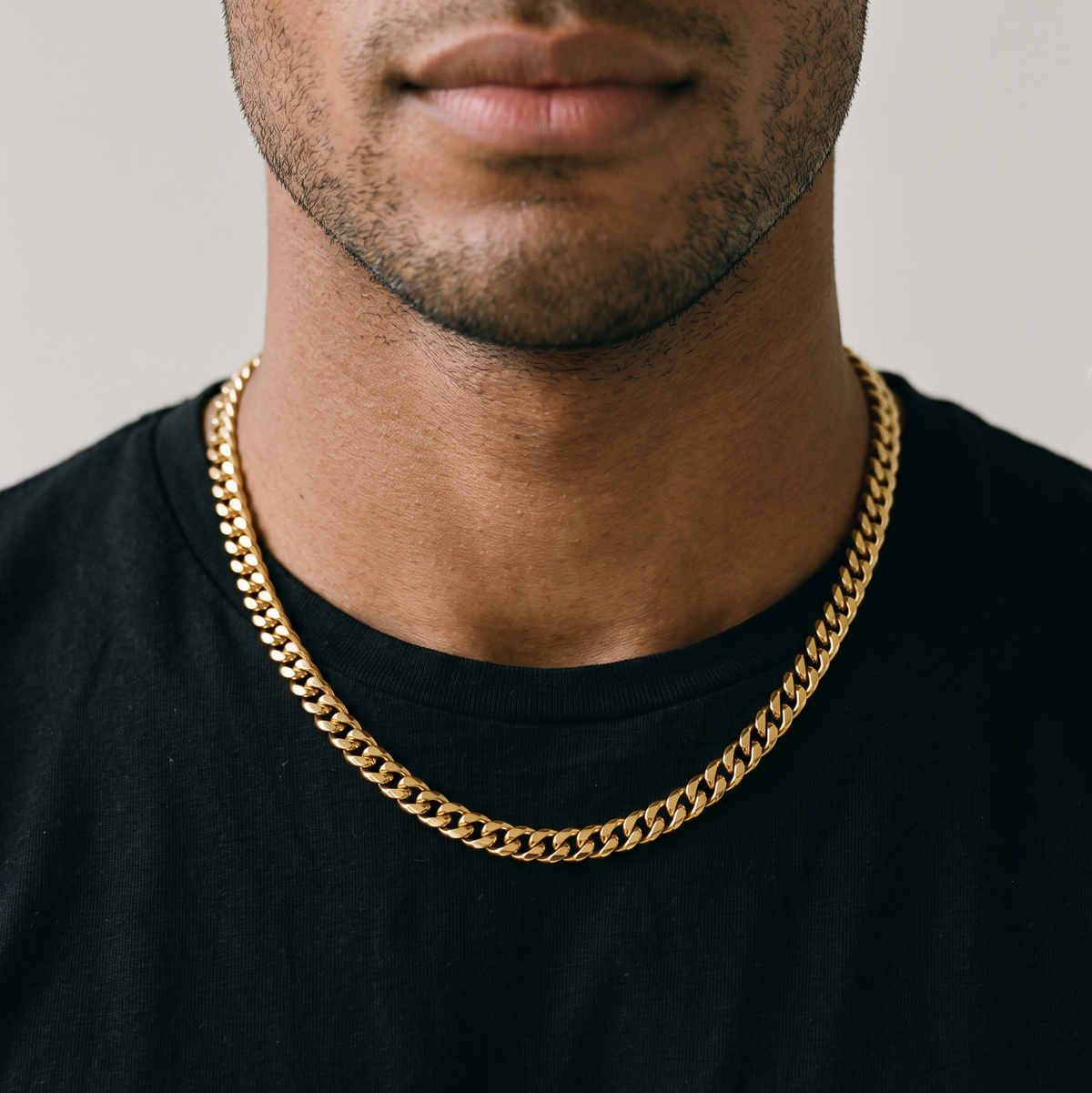 A man wearing a gold stainless steel necklace, from Australian jewellery brand Billie Jo, styled for everyday casual wear.