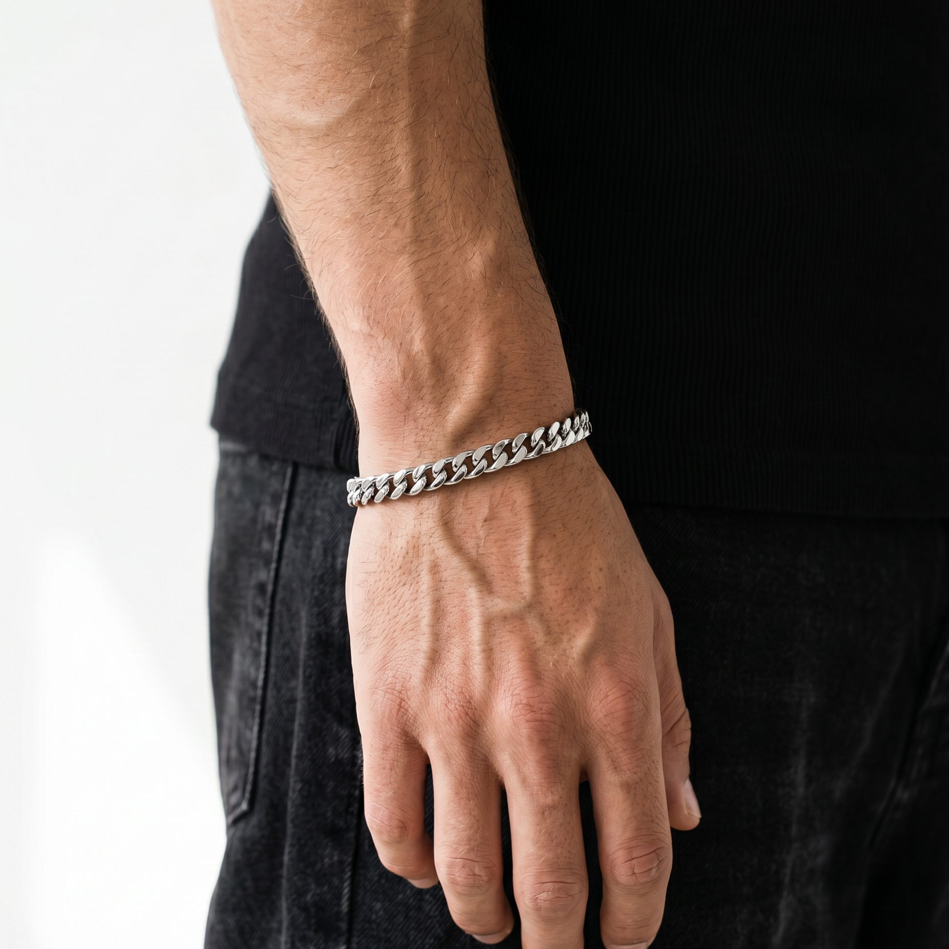 A man wearing a stainless steel silver chain bracelet from Australian jewellery brand Billie Jo, styled for everyday casual wear.