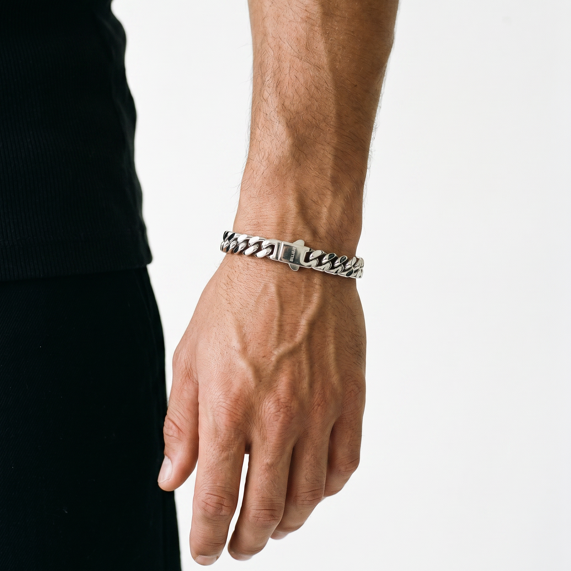 A man wearing a silver stainless steel chain bracelet from Australian jewellery brand Billie Jo, styled for everyday casual wear.