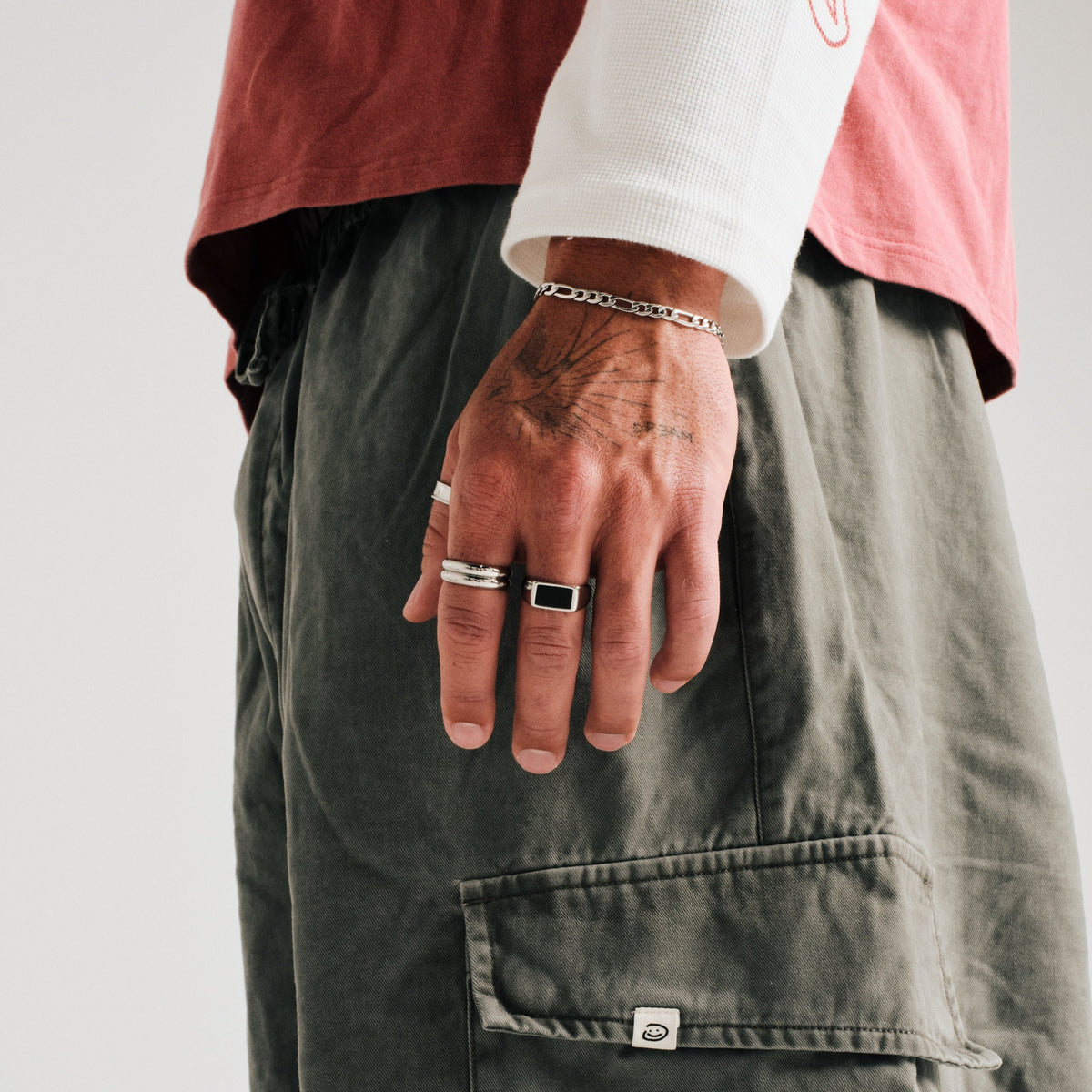 Men's Onyx Ring in 316L stainless steel, silver finish, worn on his left middle finger, hand by his side