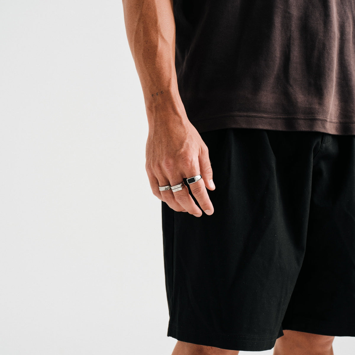 Men's Onyx Ring in 316L stainless steel, silver finish, worn on his right index finger, hand hanging by his side