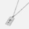 Billie Jo's sterling silver Paradiso Pendant, featuring a rustic, rectangular tag with a dark palm tree engraving for a modern, coastal aesthetic.