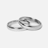 A pair of Billie Jo Stacker Rings in sterling silver, featuring a minimalist and modern design with a rustic textured finish, perfect for stacking.